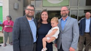 Green Bay Mayor Eric Genrich with Kelly Laughrin, daughter Clover, and Four Leaf Communications founder John Laughrin at the ribbon cutting on August 12, 2025, at the Startup Hub in Green Bay.”